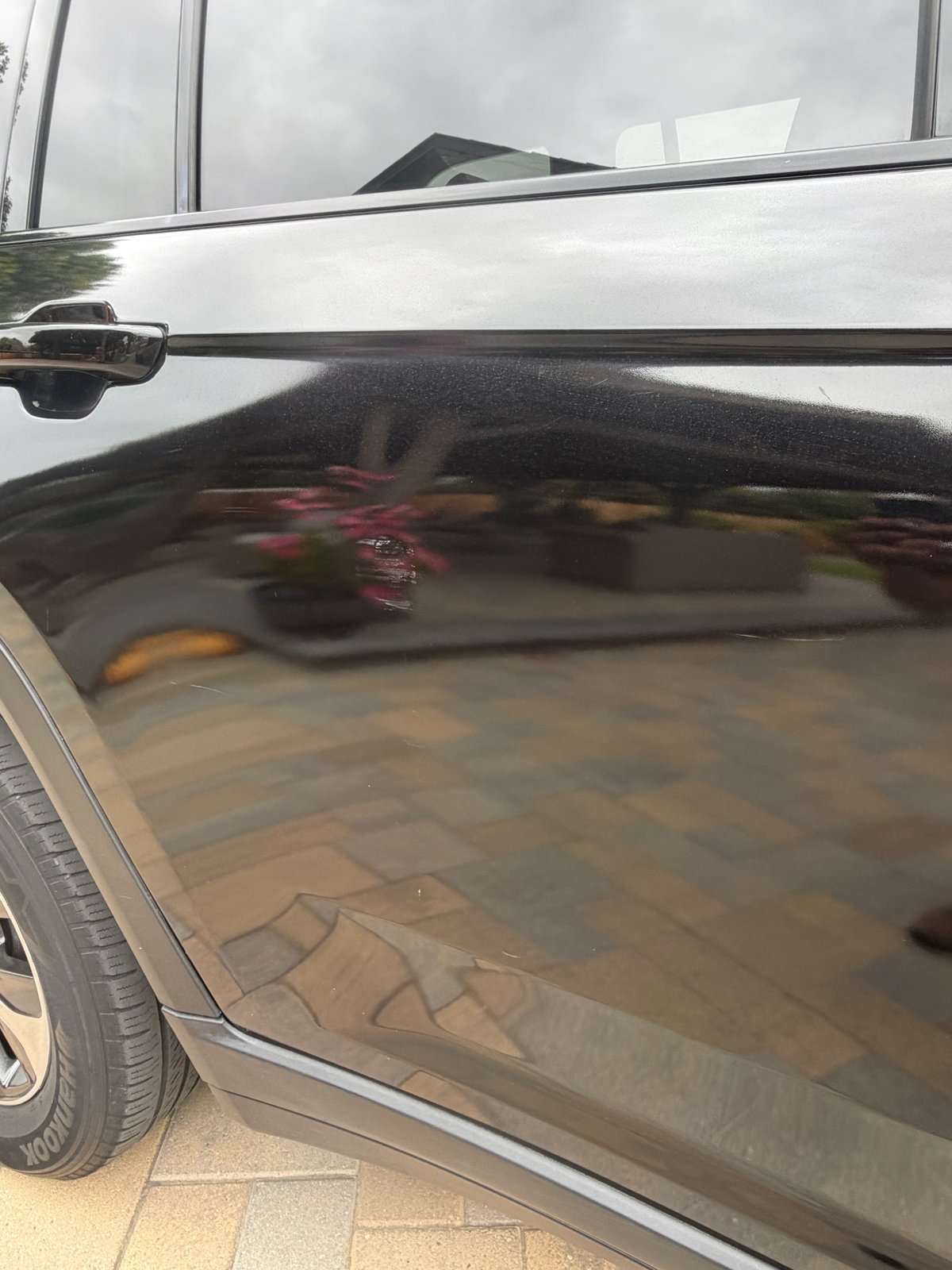 Black paint before correction, dull reflection