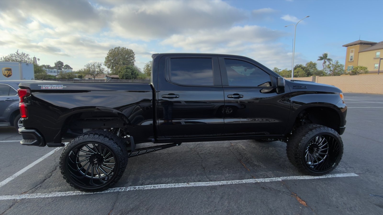 Lifted black Chevrolet Silverado Trail Boss after detail