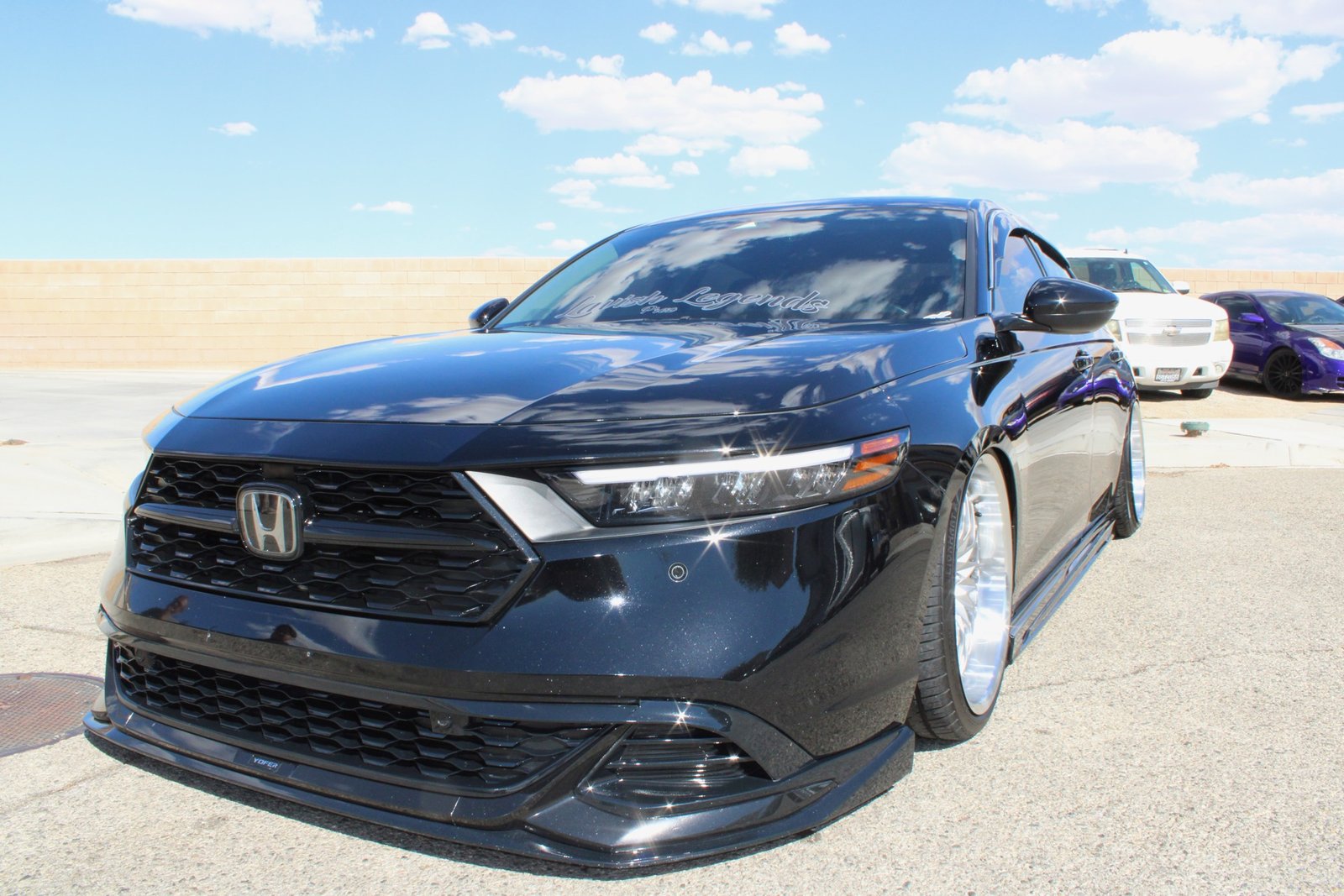 Stanced black Honda Accord with a deep, glossy exterior finish after a full detail