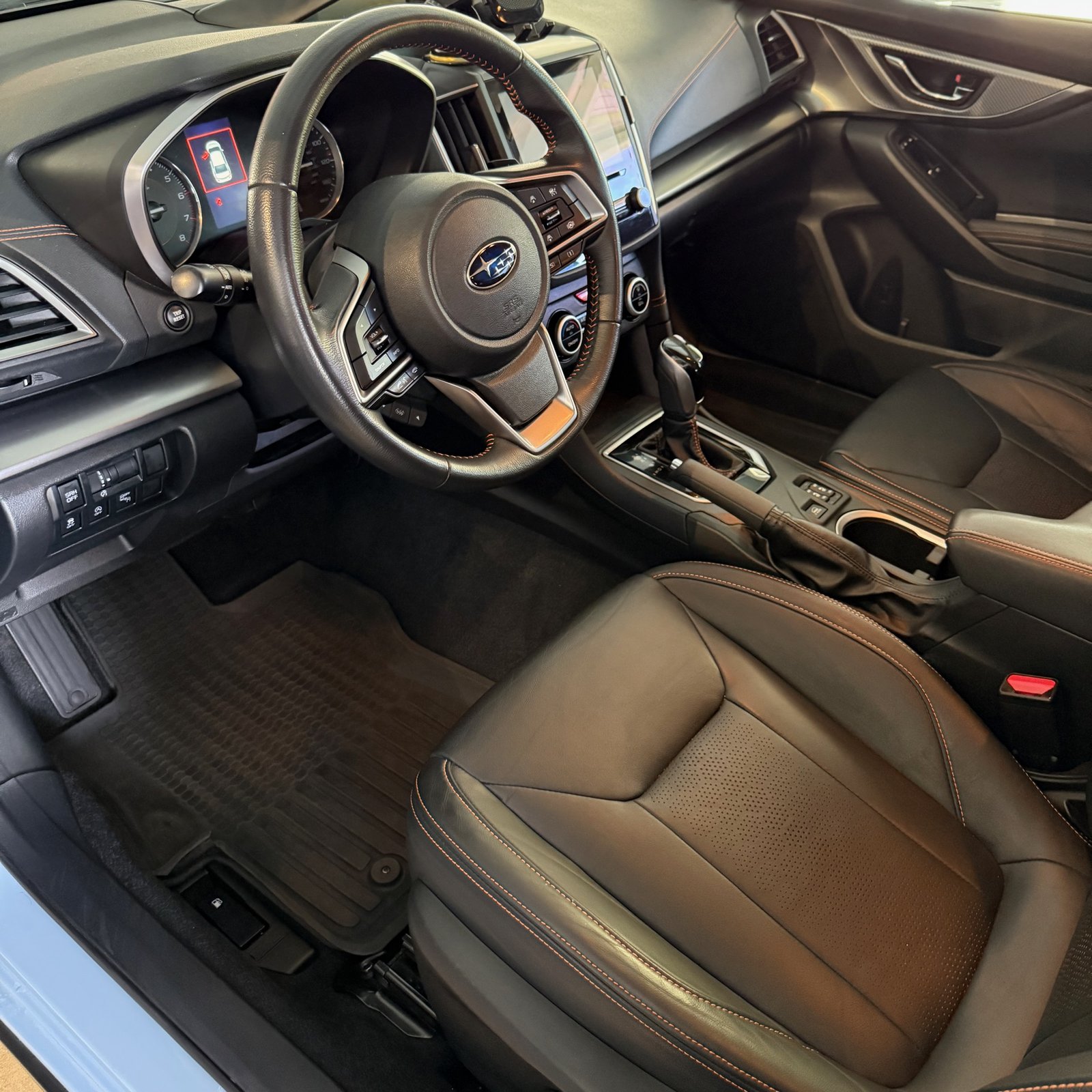 Same Subaru interior after detail, refreshed dash and seats