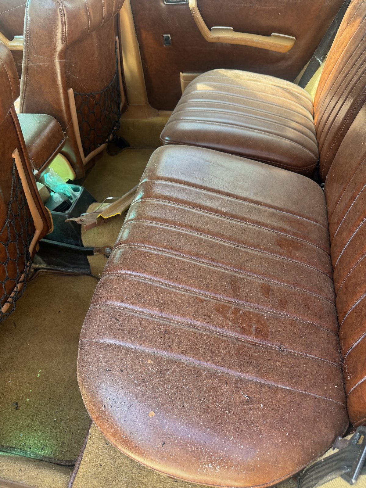 Classic Mercedes rear seat before detail, dusty and faded