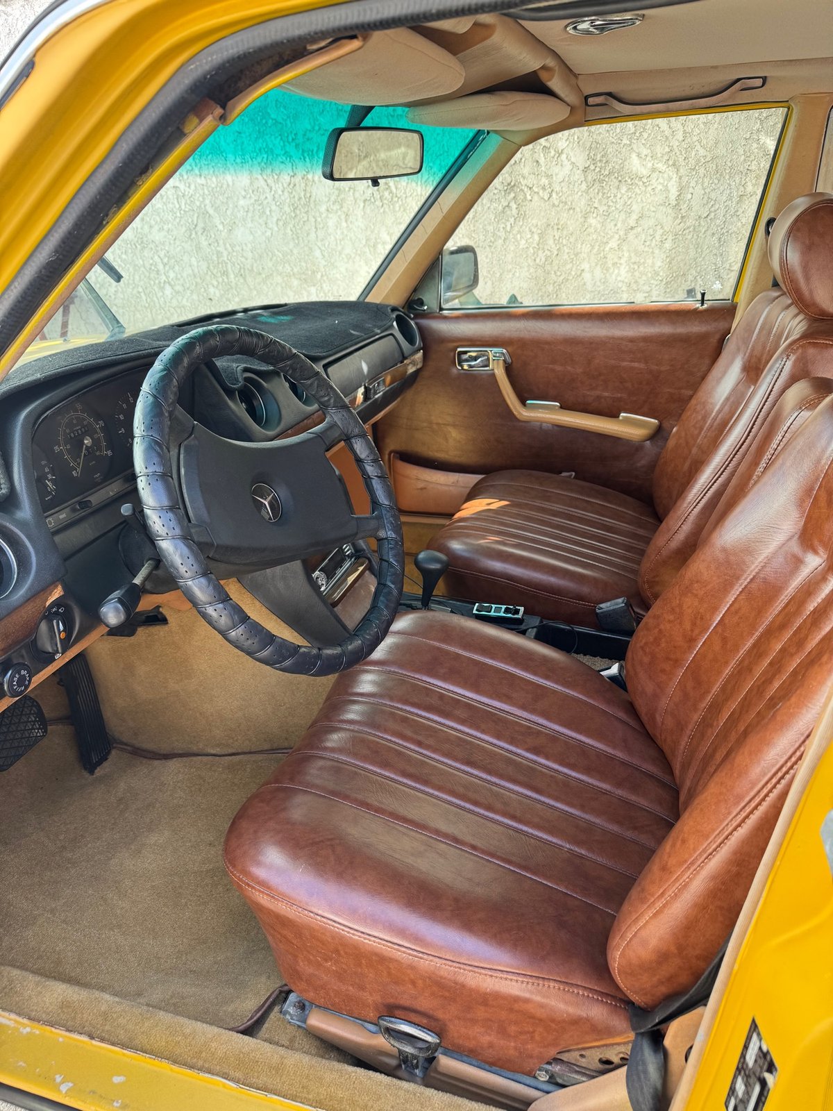 Same Mercedes front interior after detail, rich conditioned leather