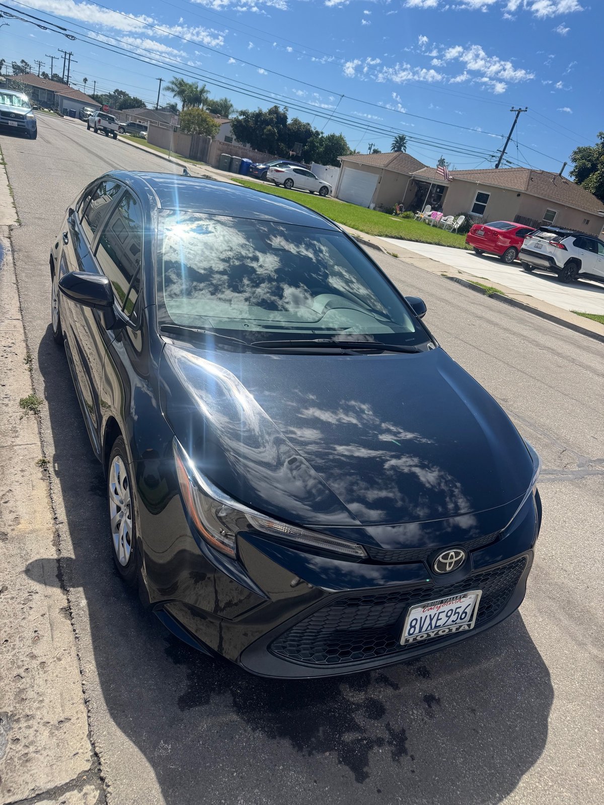 Glossy black sedan after exterior detail