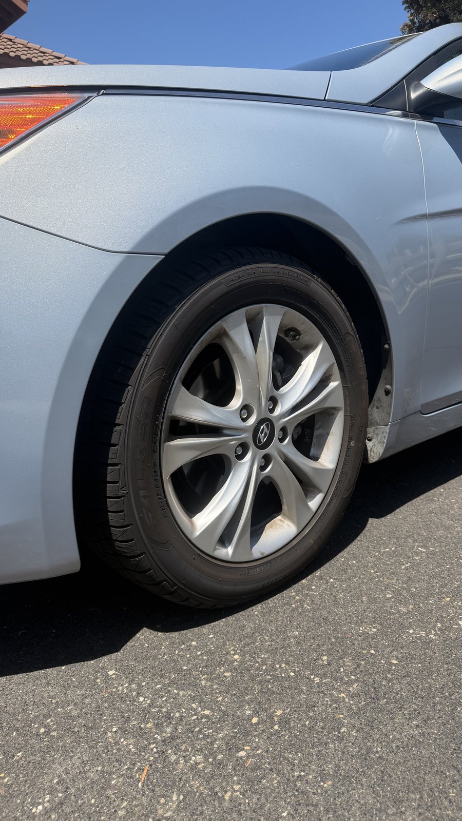 Hyundai wheel before cleaning, visible brake dust residue